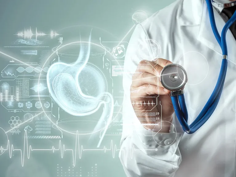 A friendly gastroenterology specialist in Dubai consulting a patient with stomach issues in a clinic