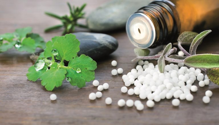 Dr. Ruchi Deshpande consulting a patient at her homeopathy clinic in Dubai.